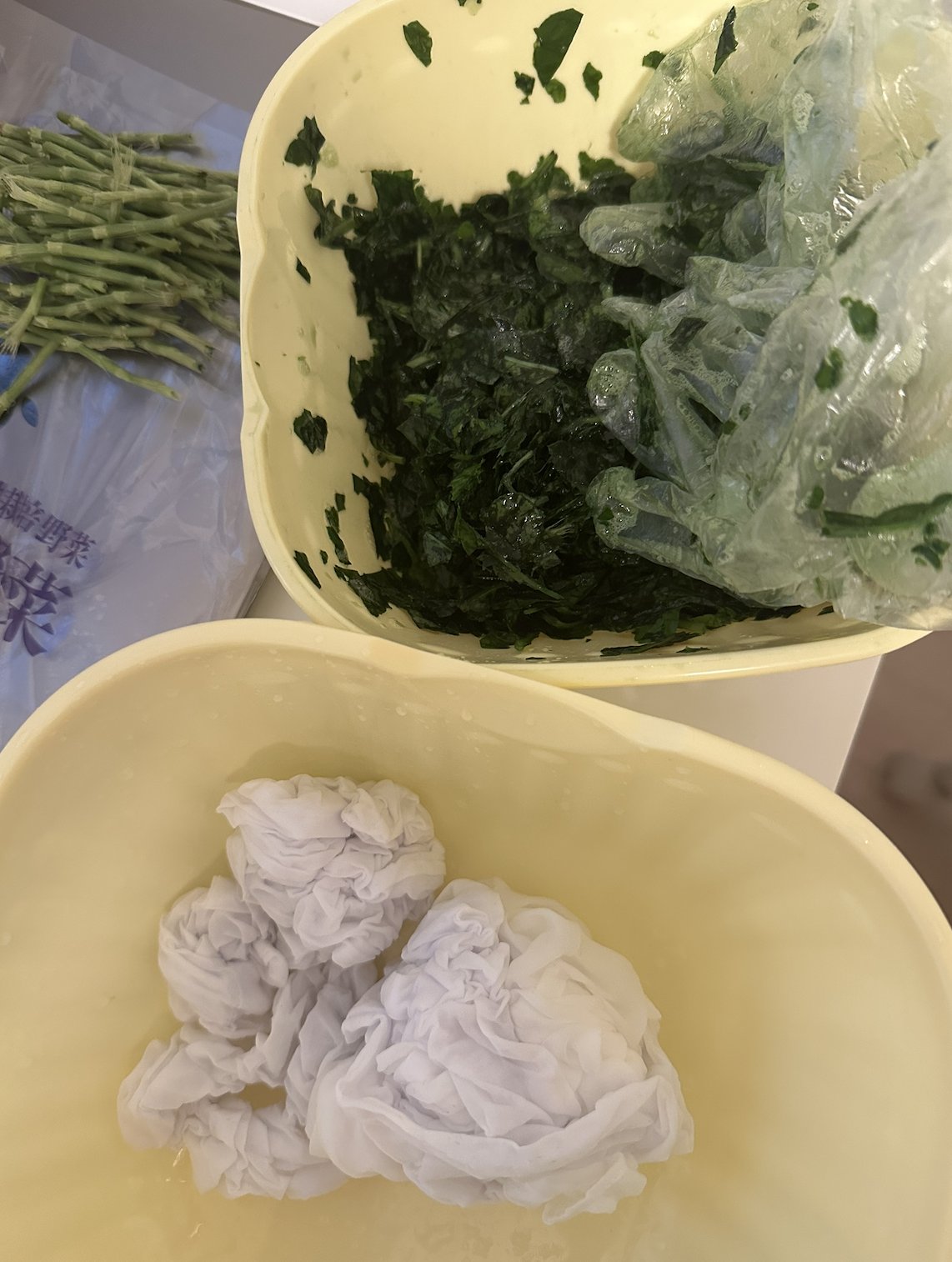 Hand-ground indigo leaves beside bound silk